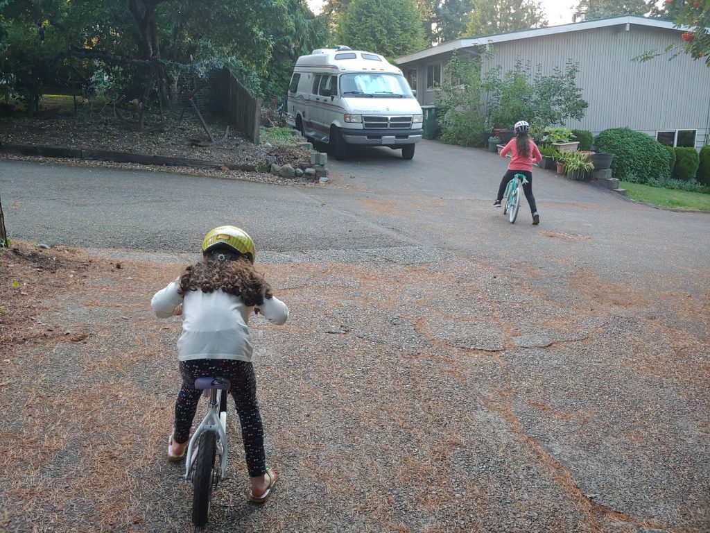 kids in the driveway on bikes