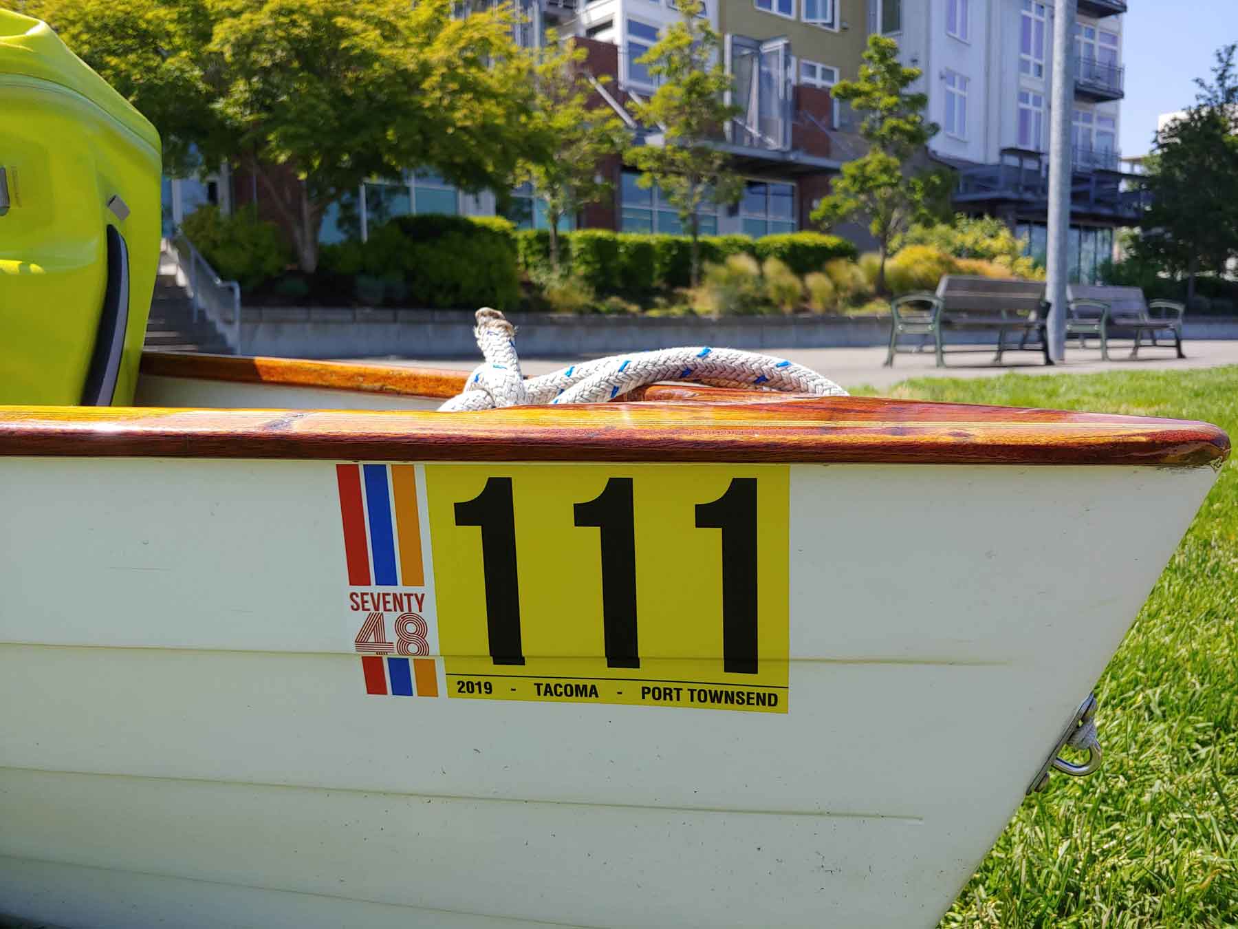 bow of a rowboat with a race sticker on it