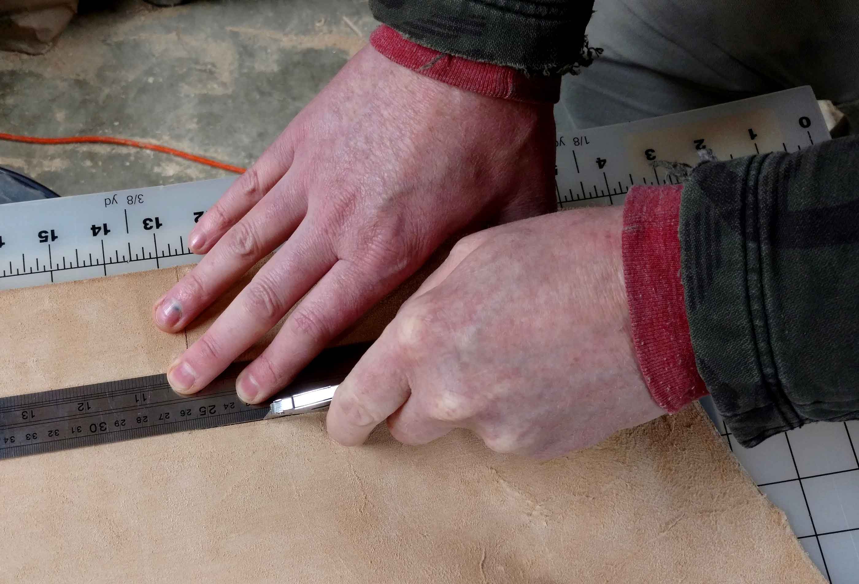 cutting leather with a knife